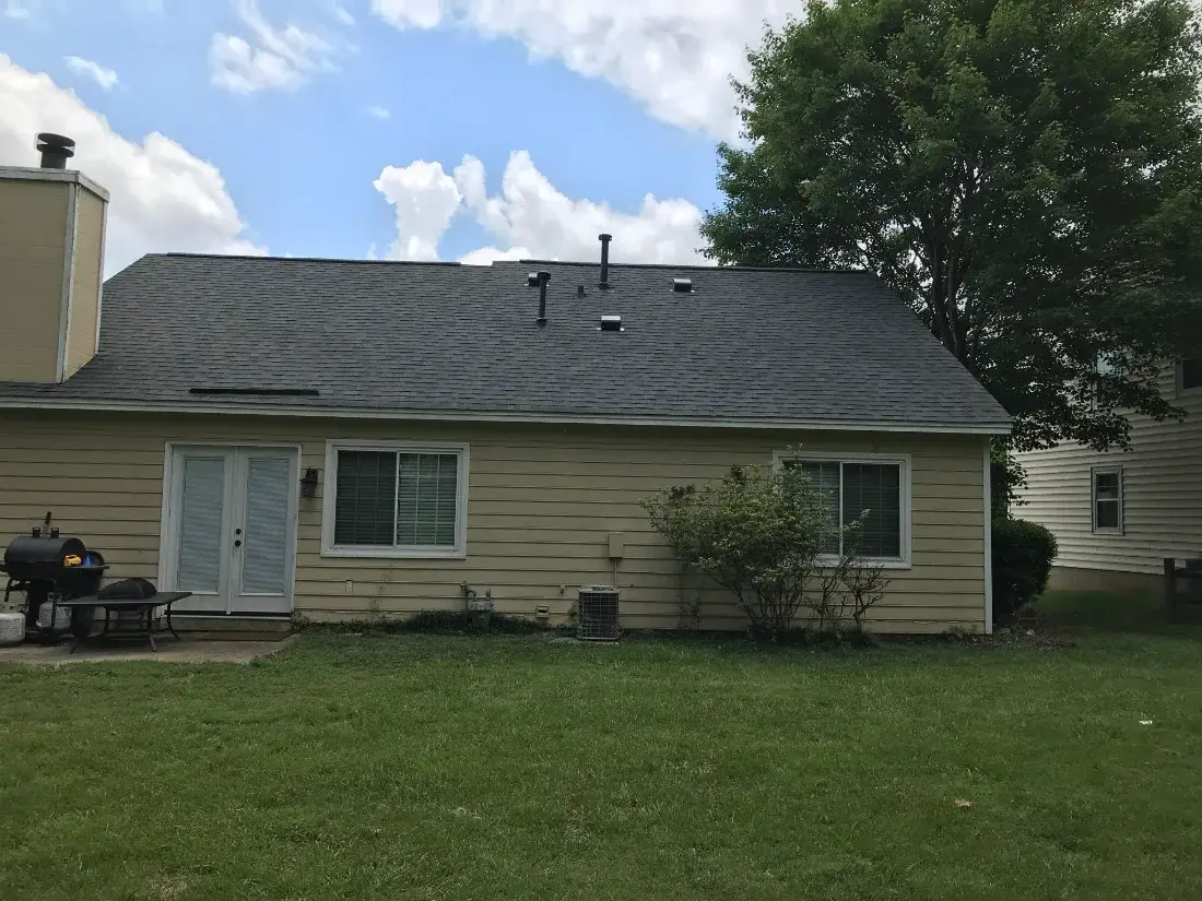 Rear view of a finished roof and gutters on a Charlotte home