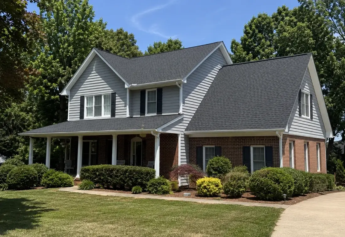 Two-story home with a new gray shingle roof